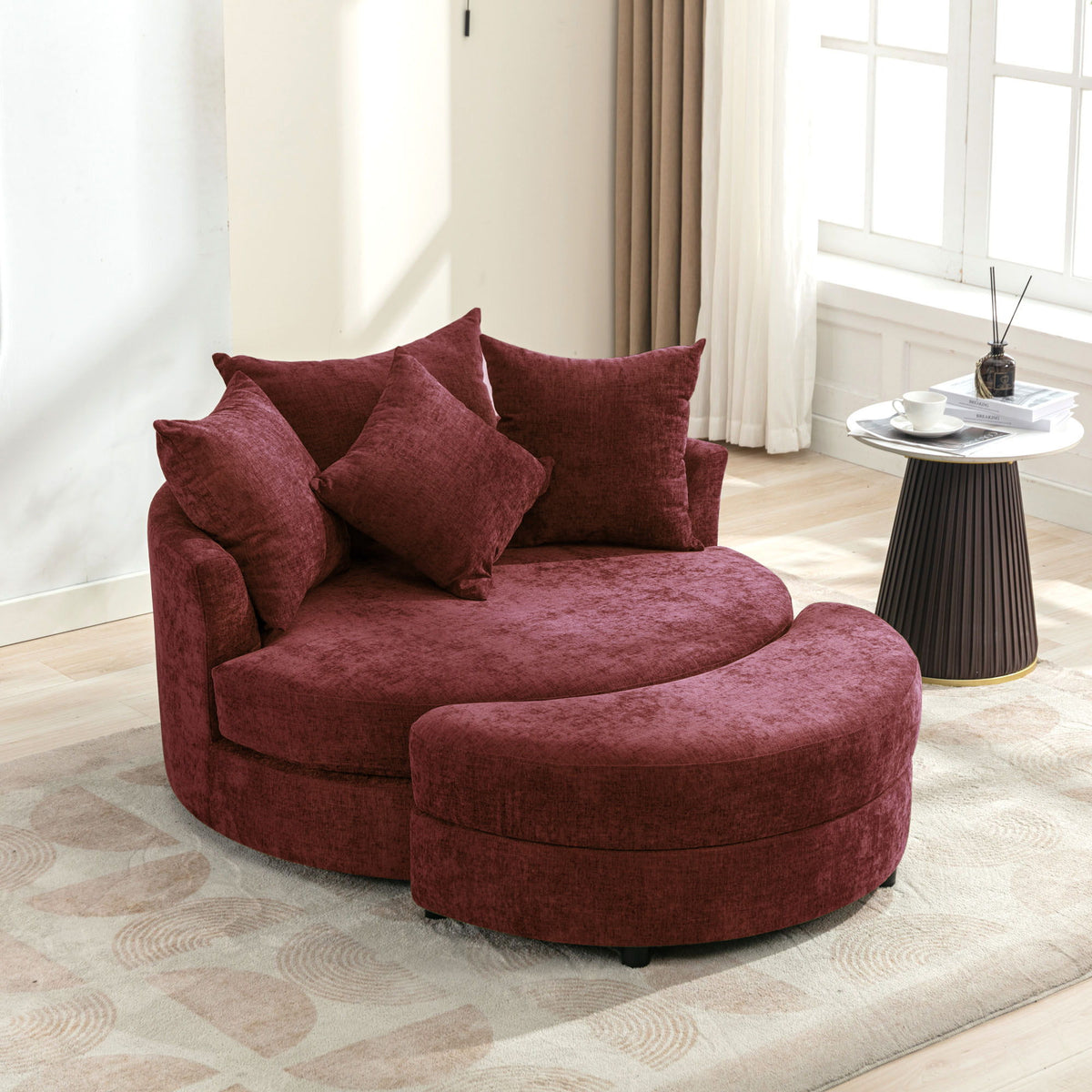 Burgundy round accent barrel chair with cushioned seat and four throw pillows