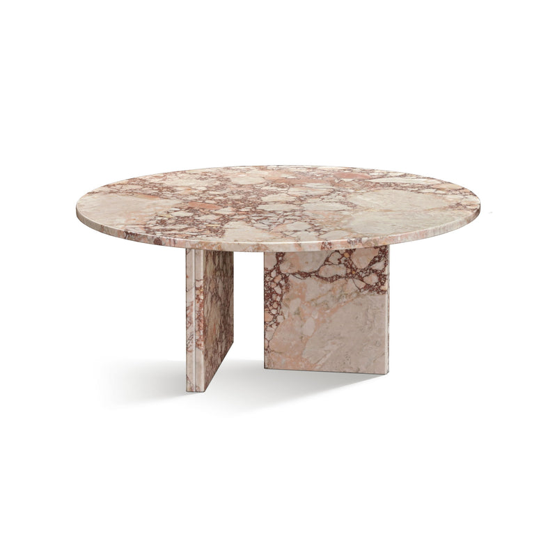 Round stone coffee table with light pink marble pattern and tapered pedestal legs