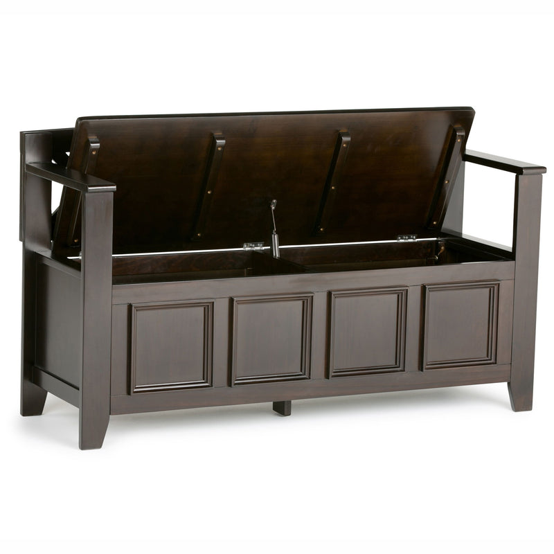 Brown entryway storage bench with flip-open top and paneled cabinet front