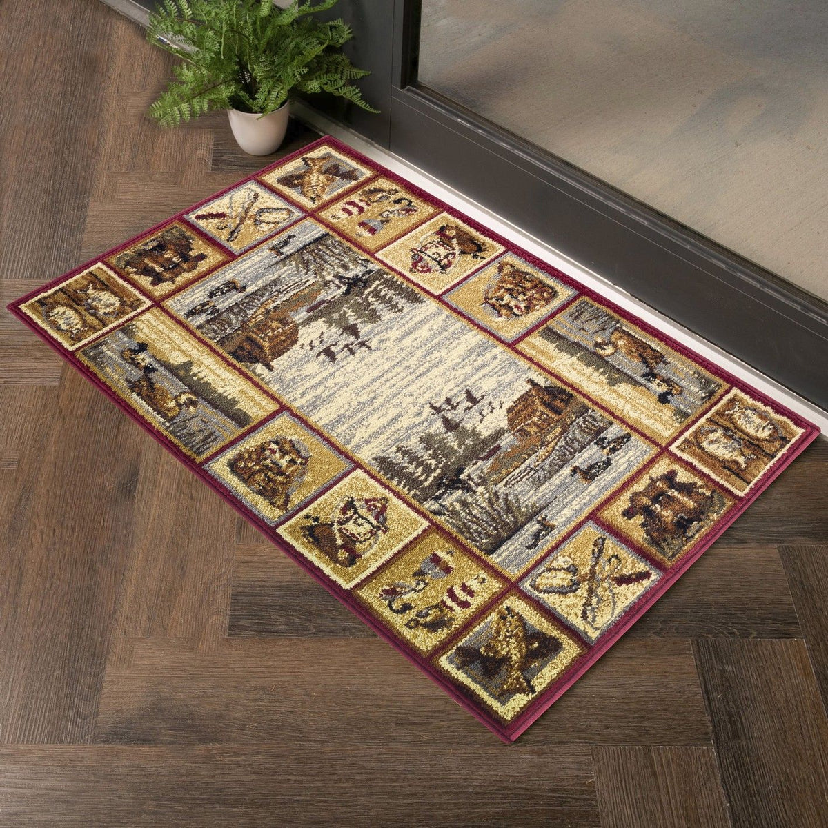 Rectangular lodge area rug with cream center, dark red border, small vintage panel motifs