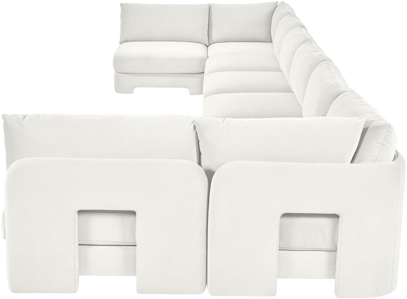 White velvet U-shaped armless sectional sofa with padded cushions and chaise backrests