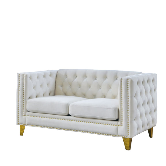 White button-tufted loveseat with dual cushion seats, studded trim, and gold legs