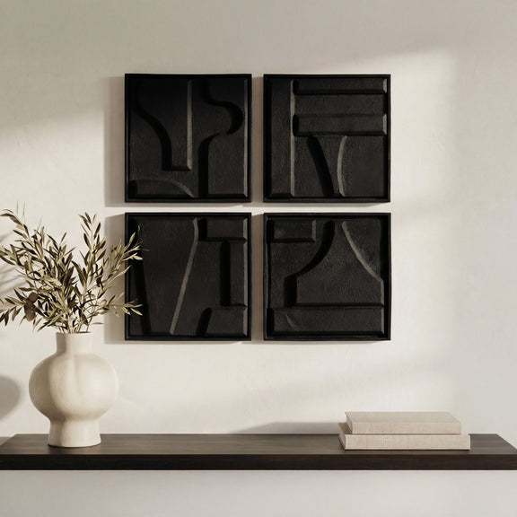 Set of four black framed square wall sculptures with abstract relief, mounted on wall