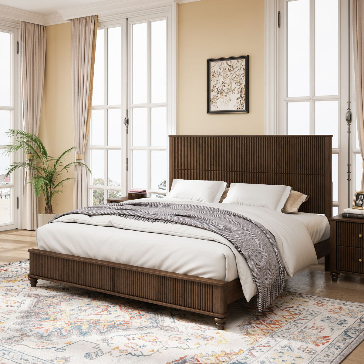 Brown paneled bed with white bedding, bedside lamps, and two matching nightstands