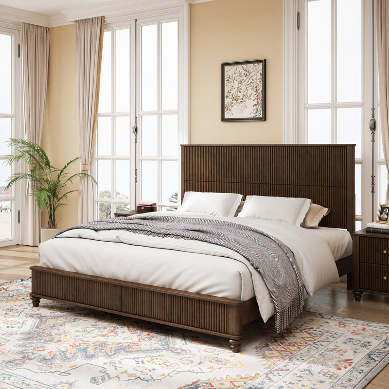Brown paneled bed with white bedding, bedside lamps, and two matching nightstands