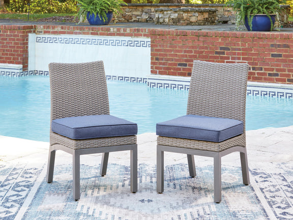 Set of 2 gray woven side chairs with blue cushions and gray legs