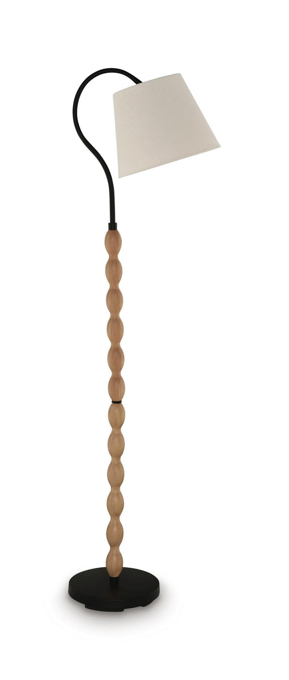 Brown wood floor lamp with black curved stand and beige drum shade, round base