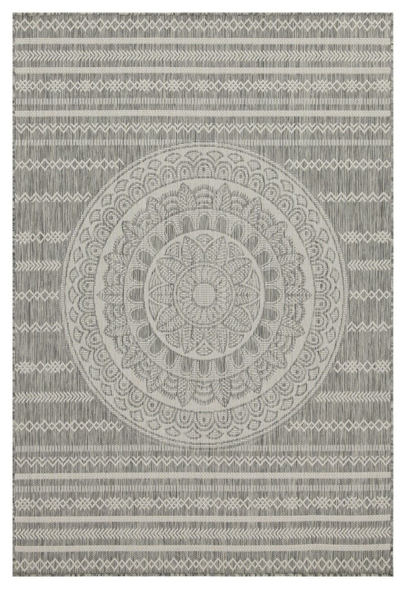 Indoor/outdoor area rug with medium gray central medallion, repeating motifs, and striped border