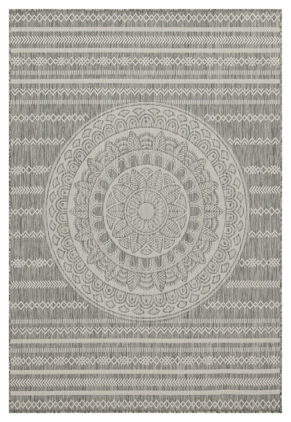 Indoor/outdoor area rug with medium gray central medallion, repeating motifs, and striped border