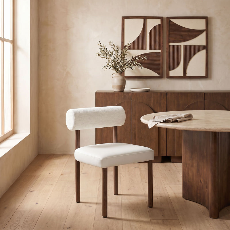 White upholstered dining chair with chenille back and vegan leather seat, wood legs.