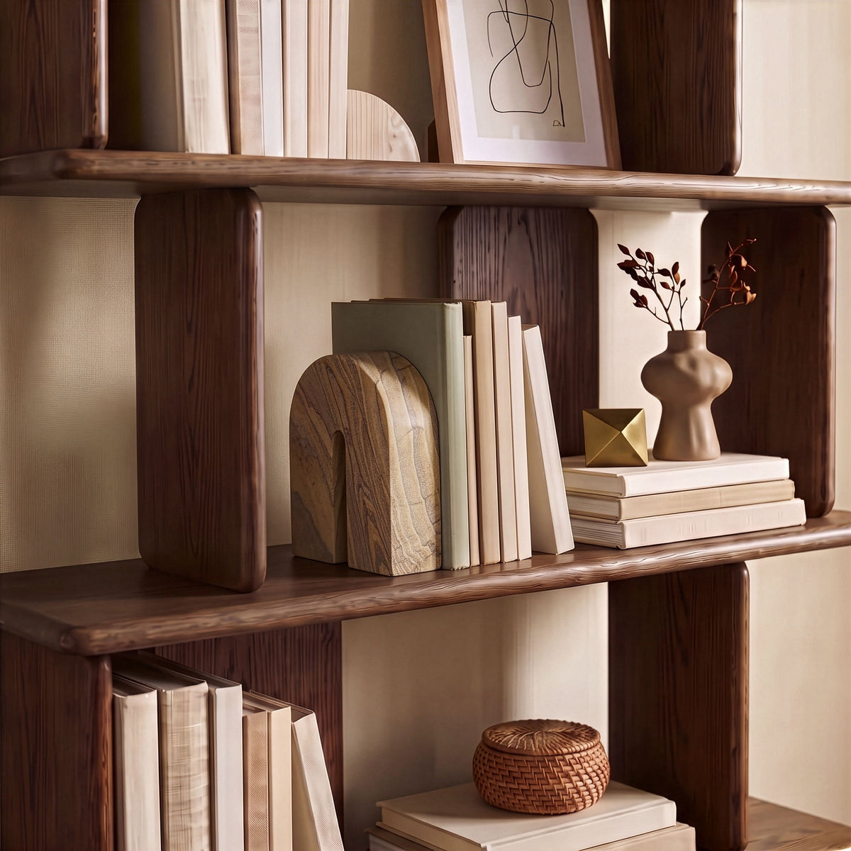 Sandstone bookend on wooden bookshelf, striped tan and brown stone