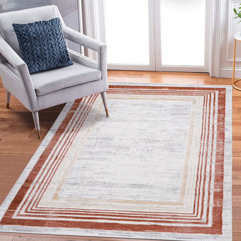 Rectangular bordered area rug in ivory and brown, angled view with striped frame