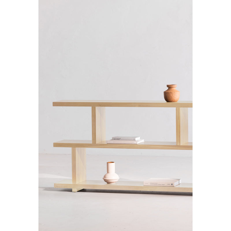 White-wash oak small shelf unit with two visible tiers and open side frame
