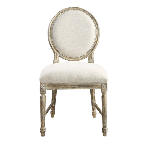 Upholstered dining chair with oval back and light beige seat cushion, distressed wooden frame