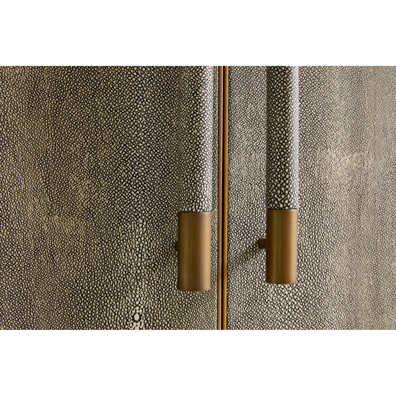 Concrete-textured gray cabinet door with brass-toned vertical bar pull handles