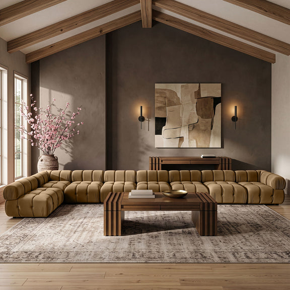 Tan velvet L-shaped sectional sofa with tufted seats and padded armrests.