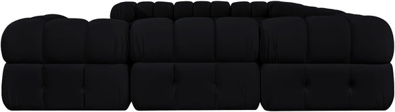 Black velvet sectional with tufted cushions, rounded arms, and blocky seat sections