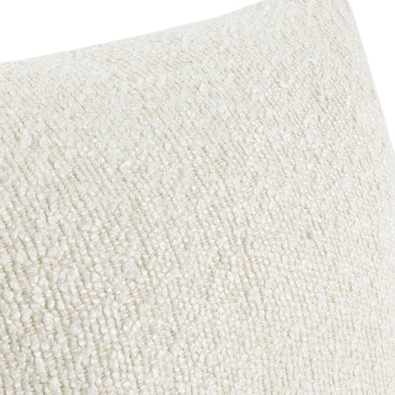 Close-up of ivory textured boucle fabric on a lumbar pillow cover