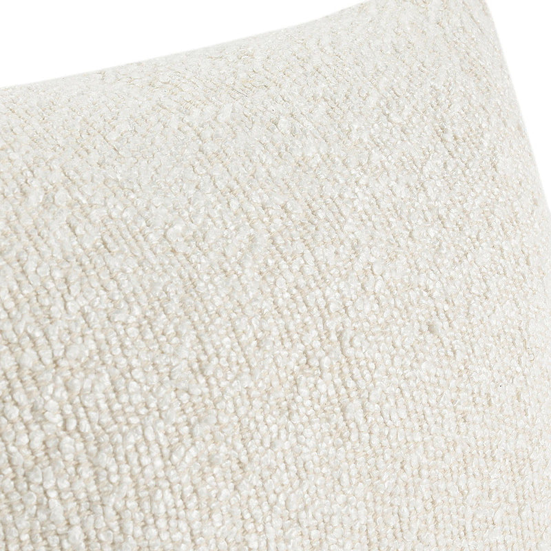 Close-up of ivory textured boucle fabric on a lumbar pillow cover
