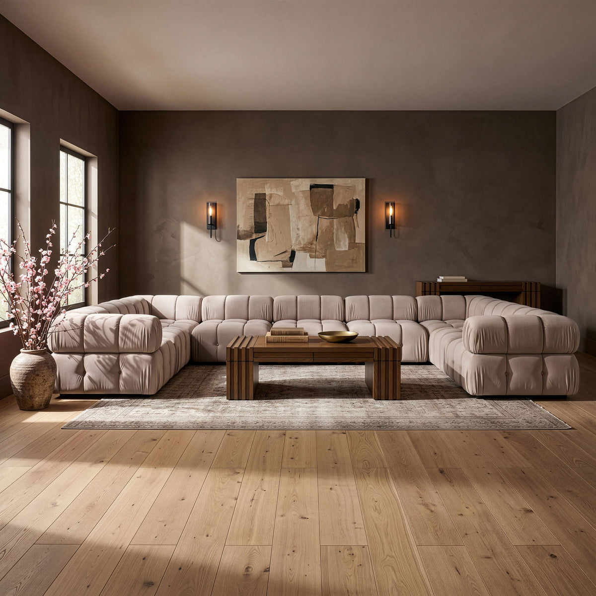 Dark gray velvet sectional sofa with tufted cushions and rounded chaise corner arms
