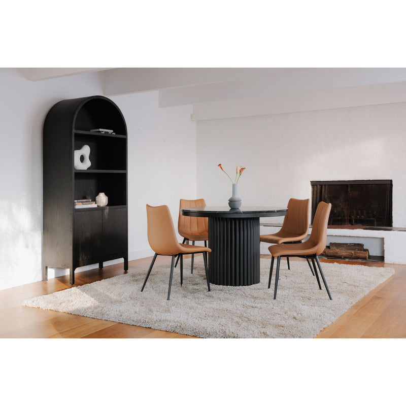 Round black dining table on fluted pedestal base with dark marble-look top