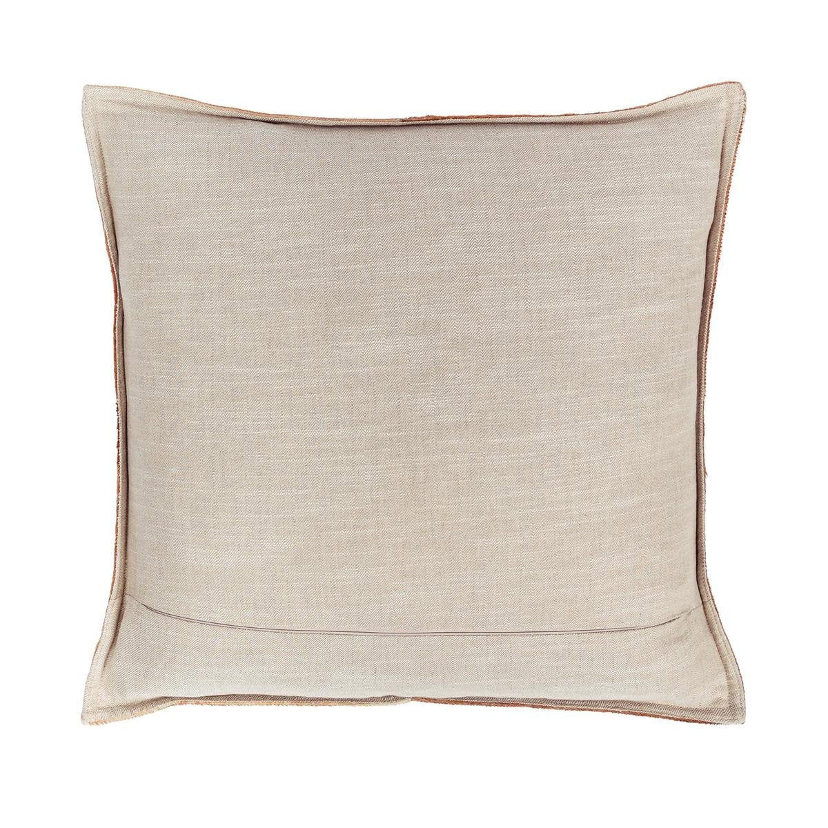 Tan fabric-backed pillow with smooth weave and stitched border
