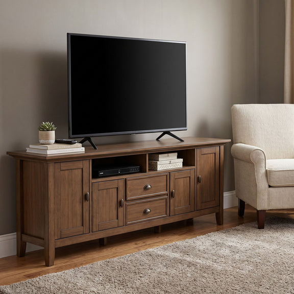 Rustic TV media stand with two cabinet doors and drawers in aged brown wood