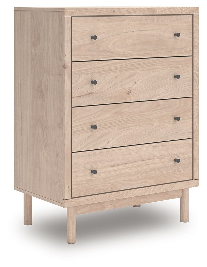 Tan wood four-drawer chest with black knobs and tapered legs