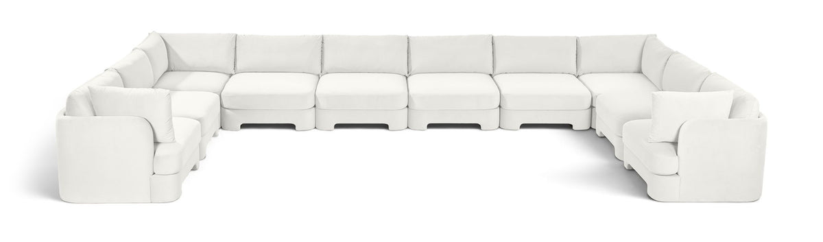 10-piece velvet sectional sofa, white modular L-shape with chaise and ottoman-style seats.