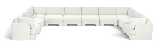 10-piece velvet sectional sofa, white modular L-shape with chaise and ottoman-style seats.