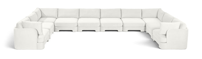 10-piece velvet sectional sofa, white modular L-shape with chaise and ottoman-style seats.