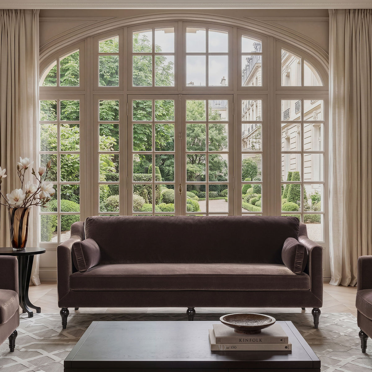 Dark brown upholstered modern sofa with squared arms and two bolster back cushions