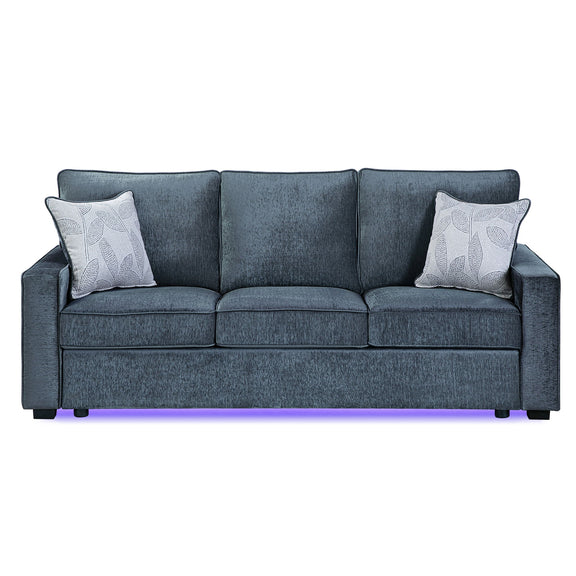 Dark blue-gray upholstered 3-seat sofa with 2 patterned throw pillows and LED base light