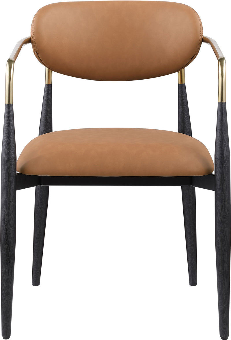 Light tan vegan leather dining arm chair with rounded back, black legs, gold arm frame