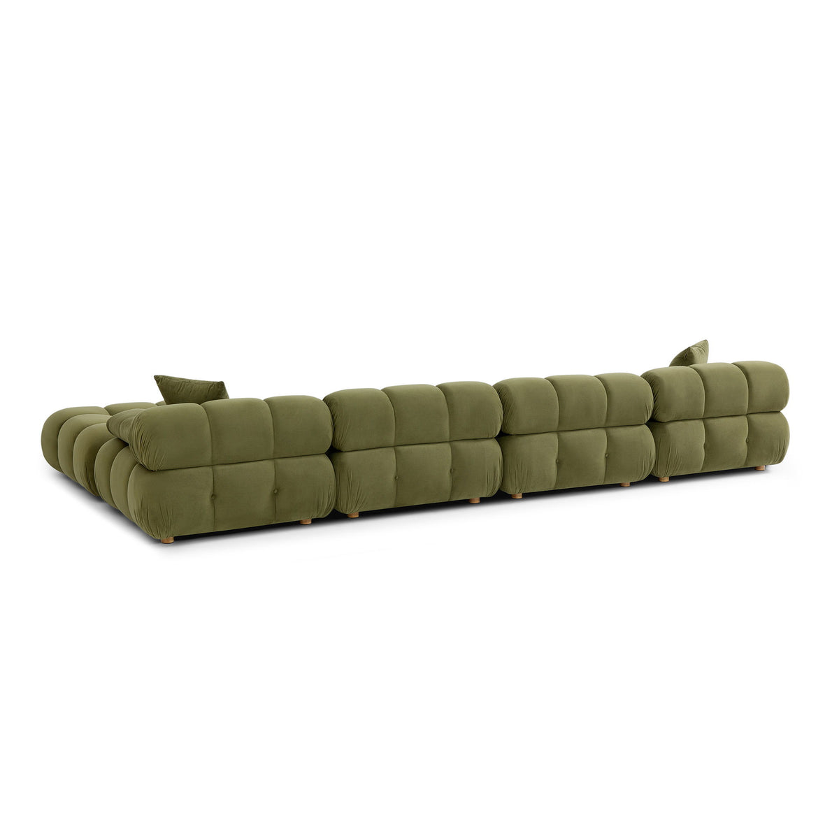 Green modular sectional sofa with chaise end, quilted cushions, and two pillows