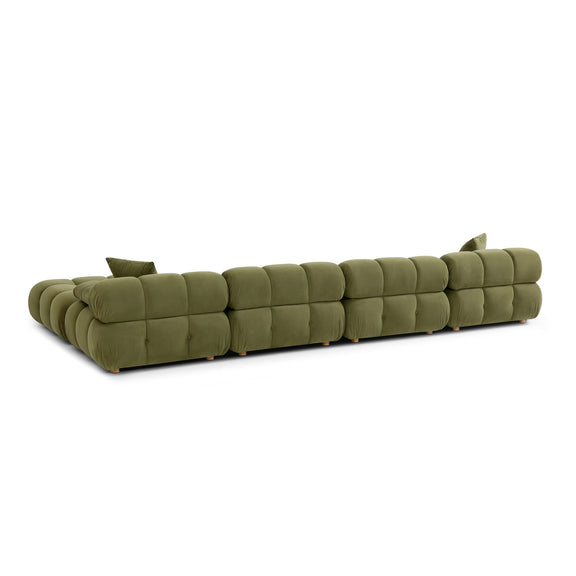 Green modular sectional sofa with chaise end, quilted cushions, and two pillows