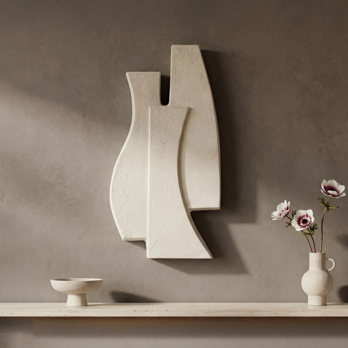 Beige abstract wall sculpture with two stacked curved panels and vertical notch
