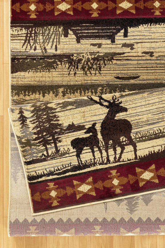 Beige lodge area rug corner with deer and cabin design, dark red band and geometric trim