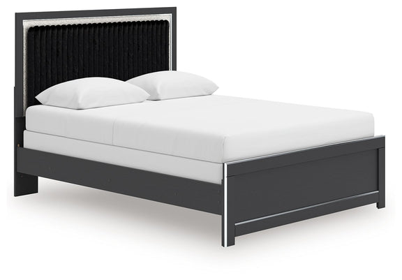 Upholstered panel bed with white mattress, dark frame, and black upholstered headboard.