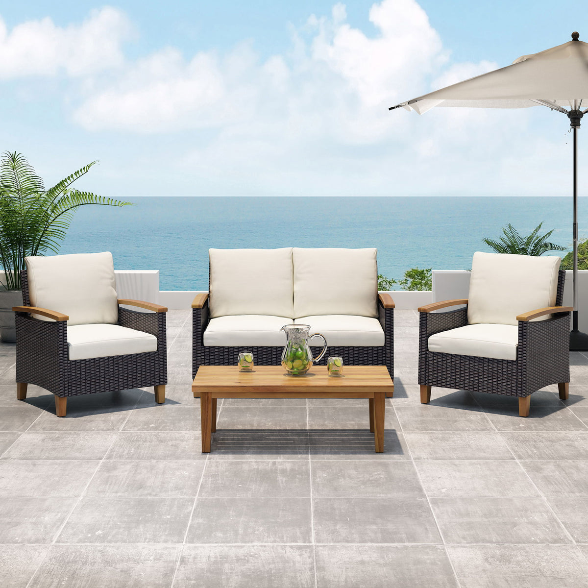 Three-piece outdoor chat set with beige cushions, dark wicker armchairs, and teak coffee table