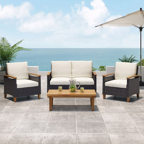 Three-piece outdoor chat set with beige cushions, dark wicker armchairs, and teak coffee table