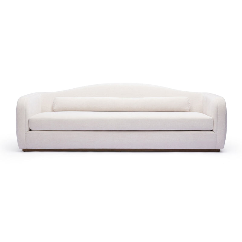 White upholstered sofa with rounded arms and box seat cushions