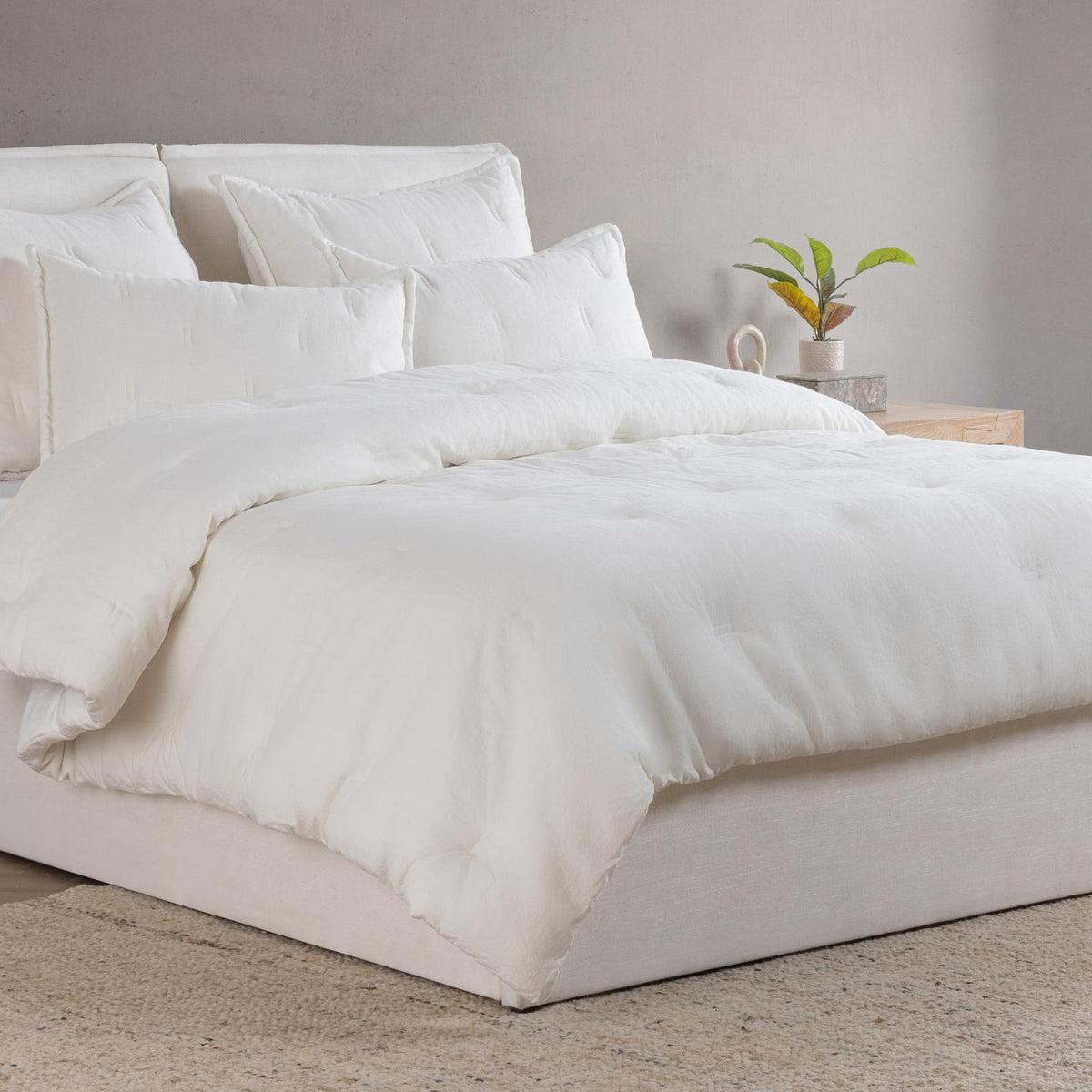 Cloud comforter sham pair on bed, solid white with clean edges