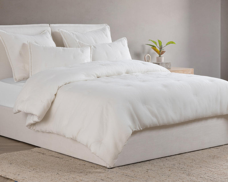 Cloud comforter sham pair on bed, solid white with clean edges