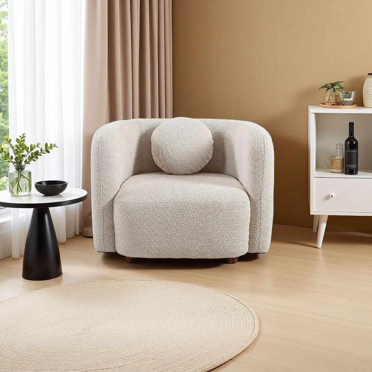 Beige upholstered accent chair with curved arms, textured seat, and short wooden legs.