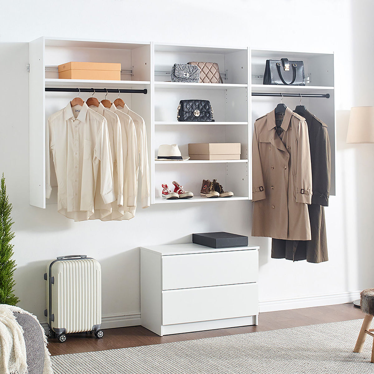 White modular closet system with open shelving, hanging rails, and drawer storage bench