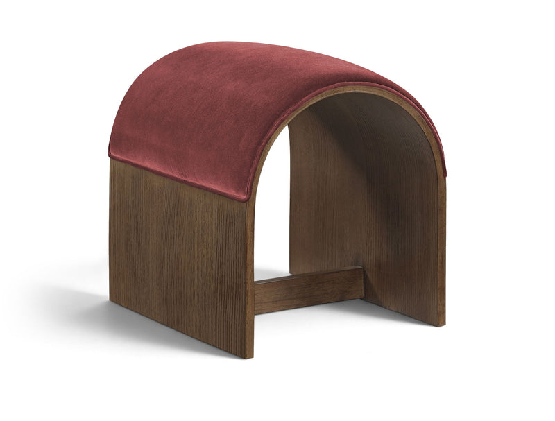 Burgundy velvet upholstered bench with arched back and dark wood base, open center