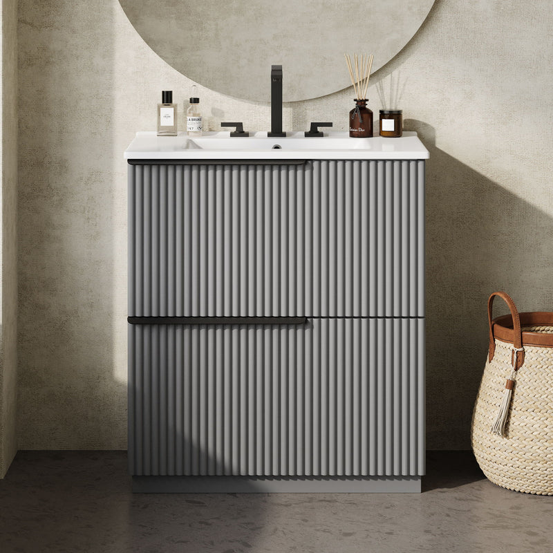 Dark gray fluted bathroom vanity with ceramic sink and two-door cabinet front view