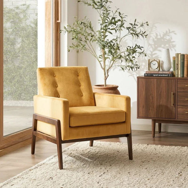 Yellow upholstered lounge chair with tufted back, padded seat, and solid wood legs.