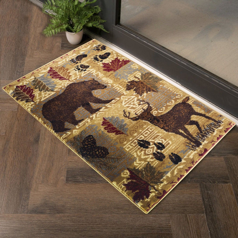 Beige lodge-style area rug with deer, bear, and paw-print pattern, diagonal view